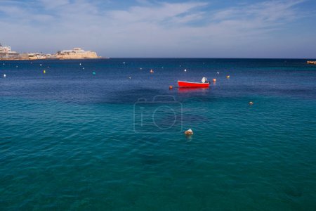 Saint Julian Bay with traditional colourful fishing Boats Luzzu, Malta