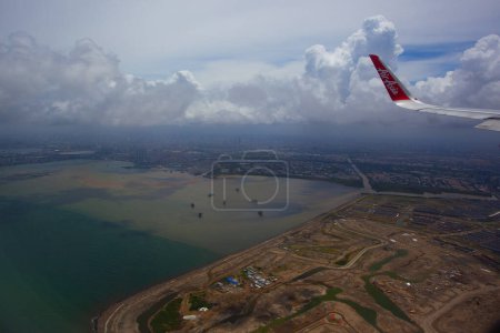 Indonesia - February 3, 2020: Airbus Airasia, Thailand low-cost airline. View from the plane window by Airasia Airline,, low-cost airline, over Indonesia