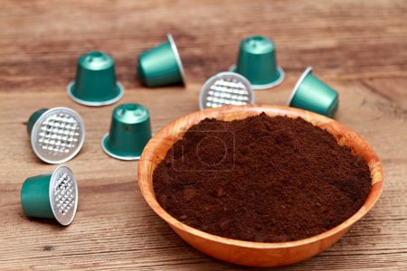 Coffee grounds in a bowl and used capsules as natural organic fertilizer. Organic and cheap way how to manure plants and flowers. 