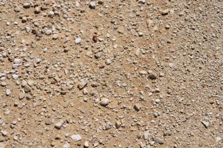 Téléchargez les photos : Détail de la surface du sol rouge avec de petites pierres - en image libre de droit