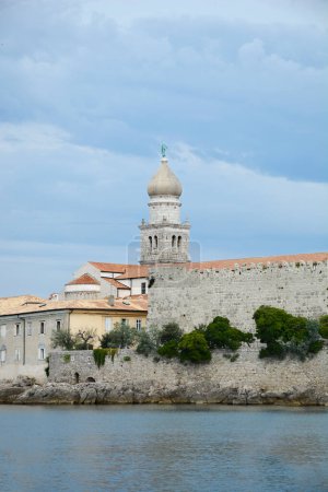 View of Church of Assumption of the Blessed Virgin Mary and fortress walls in Krk, on Krk island in Croatia