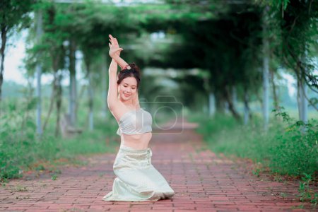 Young woman in traditional Chinese costume dancing