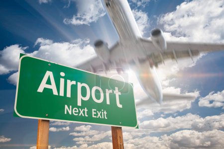Photo for Airport Next Exit Green Road Sign and Landing Airplane Above. - Royalty Free Image
