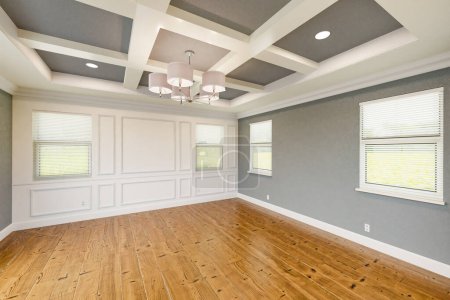 Photo for Beautiful Gray Custom Master Bedroom Complete with Entire Wainscoting Wall, Fresh Paint, Crown and Base Molding, Hard Wood Floors and Coffered Ceiling - Royalty Free Image