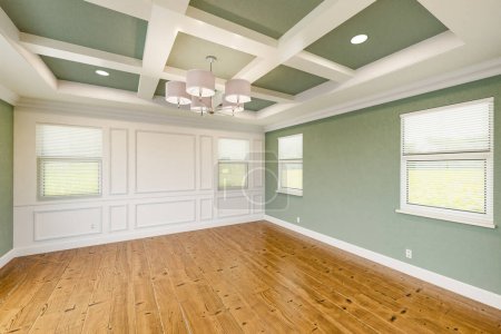 Photo for Beautiful Light Green Custom Master Bedroom Complete with Entire Wainscoting Wall, Fresh Paint, Crown and Base Molding, Hard Wood Floors and Coffered Ceiling - Royalty Free Image