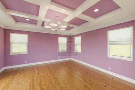 Photo for Beautiful Lilac Custom Master Bedroom Complete with Fresh Paint, Crown and Base Molding, Hard Wood Floors and Coffered Ceiling - Royalty Free Image