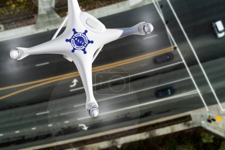 Overhead Aerial view of a Police Drone Flying Over a Traffic Intersection Crosswalk.