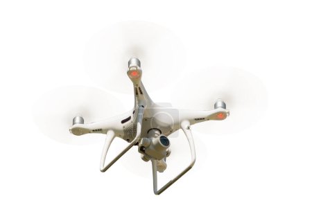Photo for Unmanned Aircraft System (UAV) Quadcopter Drone In The Air Isolated  on a White Background. - Royalty Free Image