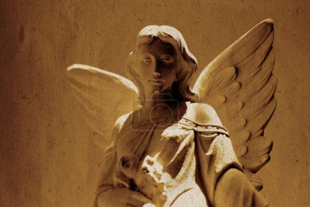 Photo for Detail of angel carved in stone statue for religious worship heaven spirituality old weathered paper texture - Royalty Free Image