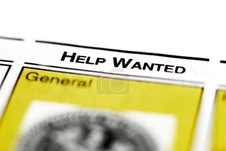 Photo for Closeup of newspaper clipping for help wanted advertisement for employmenbt and labor jobs - Royalty Free Image