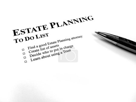 Photo for Written Estate Planning to do list on desk with pen - Royalty Free Image