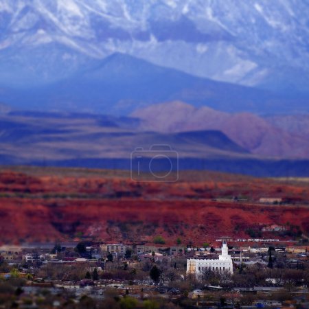 View of St. George Utah valley with Mormon LDS Temple red rocks and snow covered mountains mini blur small model scale