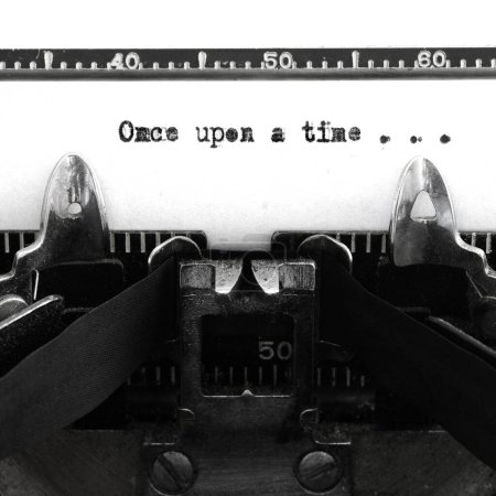 Old vintage typewriter keys and characters with words once upon a time story beginning