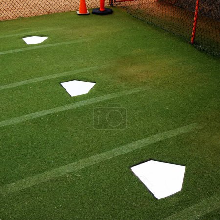 Baseball practice places in ball field for pitching and warming up