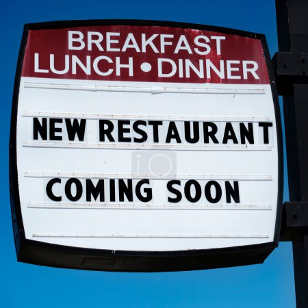 Sign for a new restaurant coming soon for breakfast lunch and dinner diner cafe