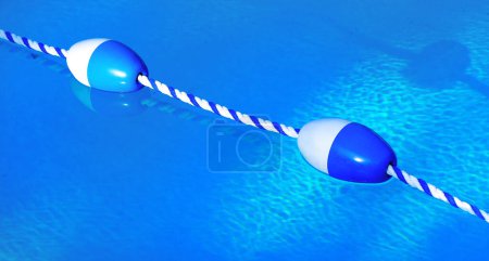 Swimming pool floating rope dividers marking lanes or areas in swimming pool