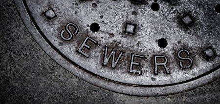 Photo for Sewer manhole cover maintenance iron steel access to utility - Royalty Free Image