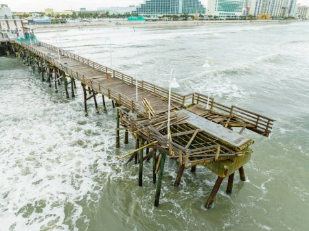 Photo for Aerial photo of the Daytona Beach pier damaged during Hurricane Nicole - Royalty Free Image