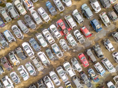 Aerial overhea shot of wrecked damaged cars at a automotive junk yard tote bag #633461786