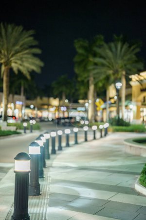 Photo for Night lit pathay in an outdoor mall scene - Royalty Free Image
