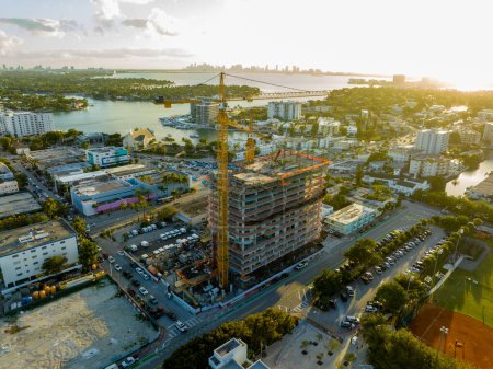 Téléchargez les photos : Miami Beach, FL, USA - February 17, 2023: Aerial photo 72nd and Park construction site mixed use development with cranes - en image libre de droit