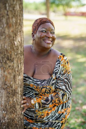 Photo for Sexy big black beautiful BBW model posing outdors in an animal print dress - Royalty Free Image