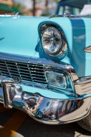 Photo for Closeup of a headlight of a blue classic vintage antique car - Royalty Free Image