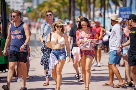 Photo for Fort Lauderdale, FL, USA - April 16, 2023: Tourists at the 2023 Tortuga Music Festival on the beach - Royalty Free Image