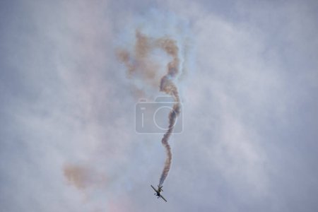 Photo for Fort Lauderdale, FL, USA - April 29, 2023: Airplane performing stunts at the Fort Lauderdale Air and Sea Show - Royalty Free Image