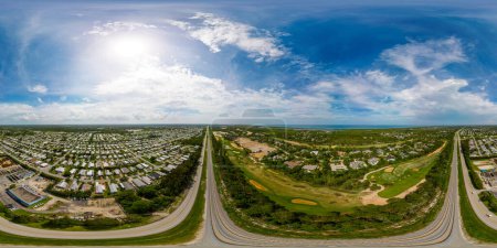 Photo for Aerial 360 photo railroad tracks splitting wealthy from poor neighborhoods in Hobe Sound FL - Royalty Free Image