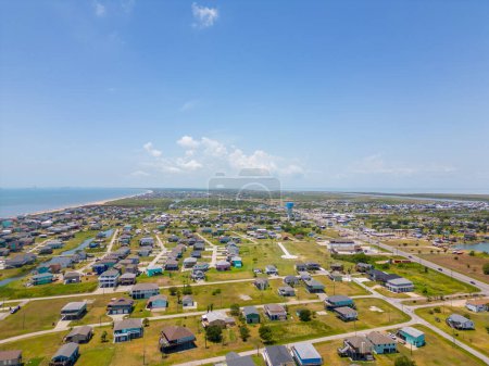 Photo for Aerial photo homes raised on stilts in flood zone Port Bolivar Texas - Royalty Free Image