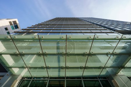 Photo for Low angle office building with glass overhand metal frame support - Royalty Free Image