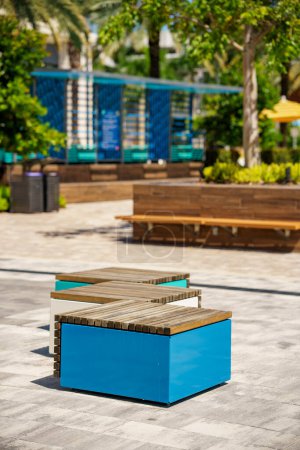 Photo for Modern patio furniture in an open air promenade. Blurry bokeh background shallow depth of focus dof - Royalty Free Image
