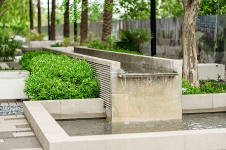 Photo for Stock photo of a city zen garden with waterfall - Royalty Free Image