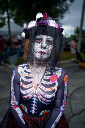 Photo for Fort Lauderdale, FL, USA - November 4, 2023: Woman with face paint dressed up for Day of the Dead Celebration and festival in Fort Lauderdale Florida - Royalty Free Image