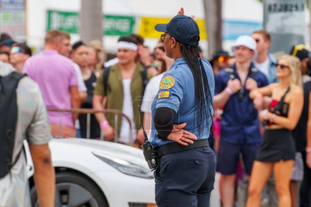 Photo for Miami, FL, USA - March 23, 2024: Police regulating traffic at Miami Ultra Music Festival - Royalty Free Image