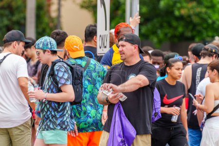 Photo for Miami, FL, USA - March 23, 2024: Man passing out Narcan nasal spray at Ultra Music Festival Miami - Royalty Free Image