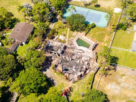 Photo for Parkland, FL, USA - April 5, 2024: Aerial photo of aftermath of 5400 Godfrey Road home burned down from fire - Royalty Free Image