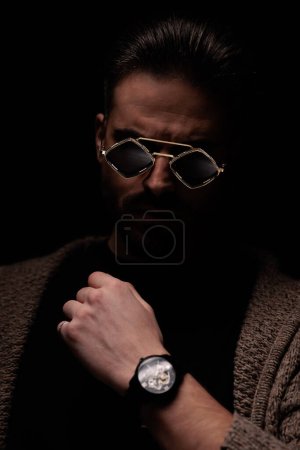 Photo for Portrait of attractive man with macho style is posing, standing, in a fashion pose - Royalty Free Image