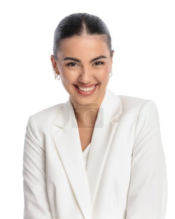 Photo for Portrait of beautiful elegant businesswoman in white suit laughing and having fun in front of white background in studio - Royalty Free Image