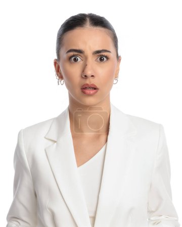 Photo for Shocked elegant woman finding out bad news and being unpleasantly surprised in front of white background - Royalty Free Image