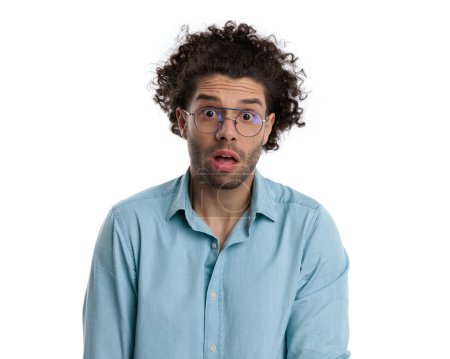 Photo for Closeup of shocked casual man with curly long hair and glasses on white background - Royalty Free Image