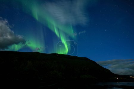 Photo for Scenic view of northern lights over calm lake .Abisko national park in Sweden. - Royalty Free Image