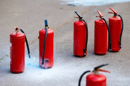 Photo for Group of red fire extinguisher containers - Royalty Free Image