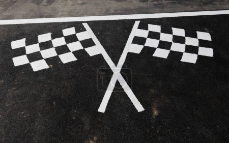 Checked flag at motorsport race track on road