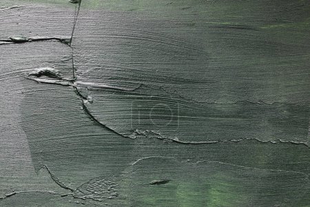 Photo for Overhead of mixed media backdrop. Plaster, wood and acrylic paint used. Variety of green, black and whites used to give a grunge look. Painted texture. - Royalty Free Image
