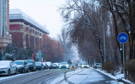 Photo for Winter and snowfall in the cozy streets of city - Royalty Free Image