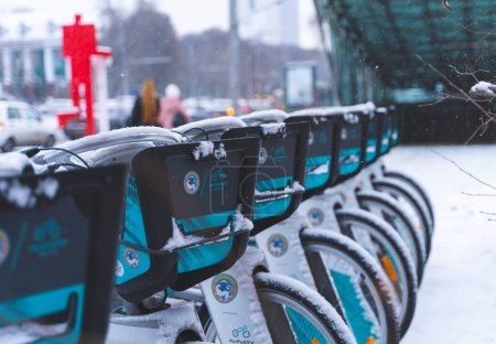 Photo for Almaty, Kazakhstan - December 09, 2022 - Rental city bikes at docking station covered with snow. - Royalty Free Image