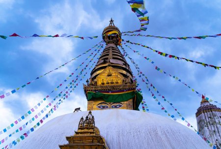 Photo for Swayambhunath Stupa with buddhist prayer flags swaying in the wind and monkey silhouette. Kathmandu, Nepal. - Royalty Free Image