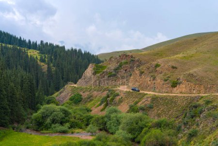 Mountain road with car. Beautiful nature of Kazakhstan near Almaty.